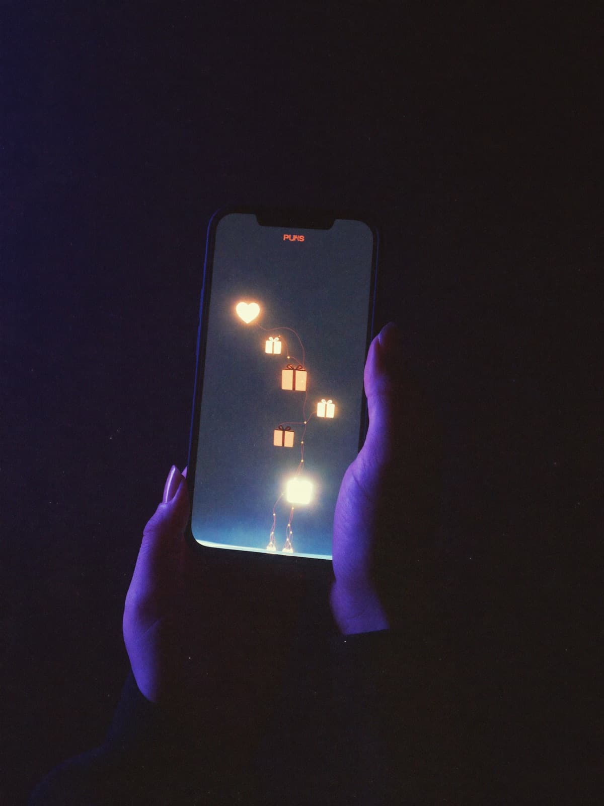 A phone glowing with rising gift icons mid-stream